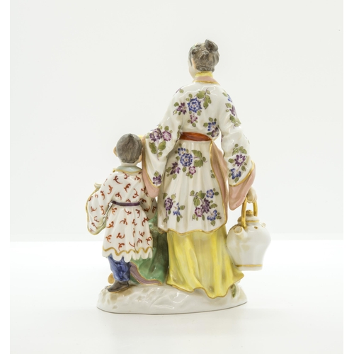 1096 - A MEISSEN FIGURAL GROUP OF JAPANESE WOMAN WITH A TEA KETTLE AND TWO CHILDREN20th century, with blue ... 