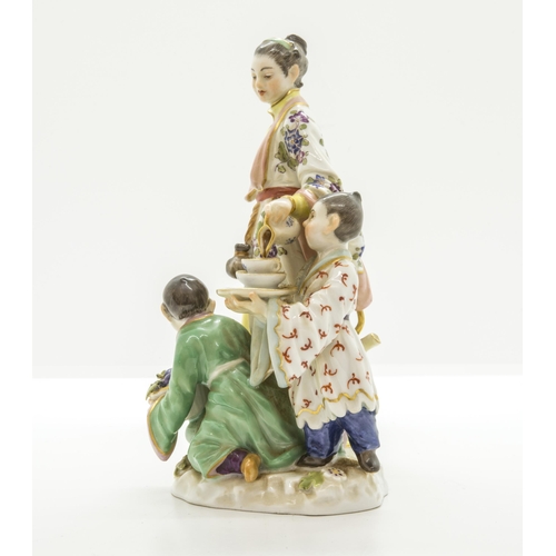 1096 - A MEISSEN FIGURAL GROUP OF JAPANESE WOMAN WITH A TEA KETTLE AND TWO CHILDREN20th century, with blue ... 