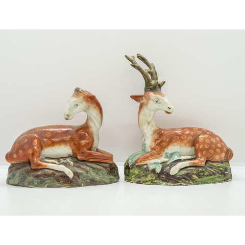 1098 - A PAIR OF STAFFORDSHIRE RECUMBANT DEERCirca 1830, 19cms high