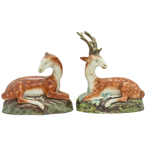 1098 - A PAIR OF STAFFORDSHIRE RECUMBANT DEERCirca 1830, 19cms high