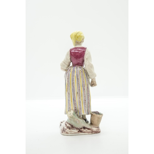 1102 - THREE FAIENCE FIGURES18th century or later, a shepherdess, a grape harvester and a hurdy-gurdy playe... 