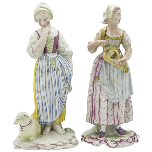 1102 - THREE FAIENCE FIGURES18th century or later, a shepherdess, a grape harvester and a hurdy-gurdy playe... 