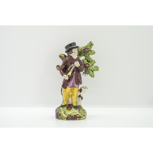 1105 - A PEARLWARE FIGURE OF A SPORTSMANCirca 1830, 15.5cms high