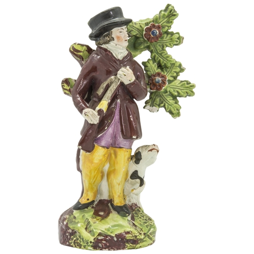 1105 - A PEARLWARE FIGURE OF A SPORTSMANCirca 1830, 15.5cms high