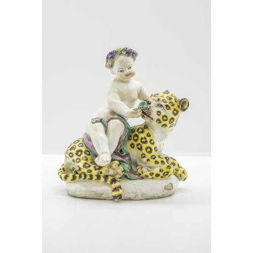 1109 - AN EIGHTEENTH CENTURY FIGURE OF A CUPID ON A LEOPARD, PROBABBLY BOWCirca 1760, 15cms high