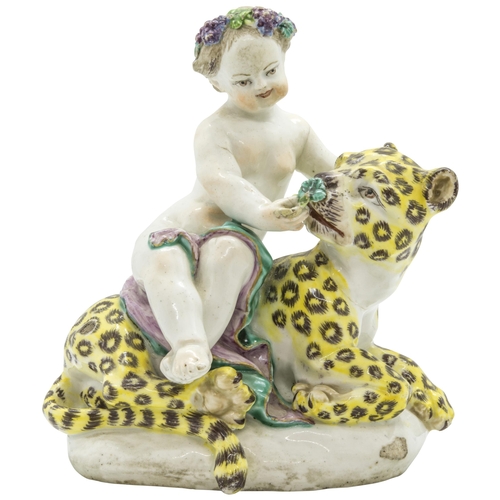 1109 - AN EIGHTEENTH CENTURY FIGURE OF A CUPID ON A LEOPARD, PROBABBLY BOWCirca 1760, 15cms high