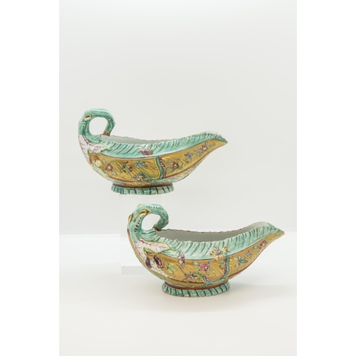 1112 - AN UNUSUAL PAIR OF WORCESTER LEAF SAUCE BOATS WITH LATER CLOBBERED DECORATION18th century, 18cms wid... 