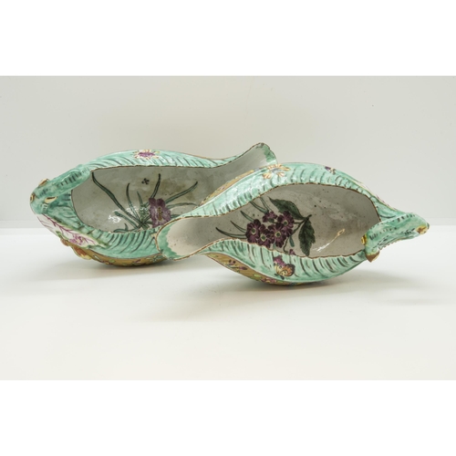 1112 - AN UNUSUAL PAIR OF WORCESTER LEAF SAUCE BOATS WITH LATER CLOBBERED DECORATION18th century, 18cms wid... 