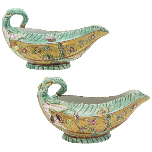 1112 - AN UNUSUAL PAIR OF WORCESTER LEAF SAUCE BOATS WITH LATER CLOBBERED DECORATION18th century, 18cms wid... 