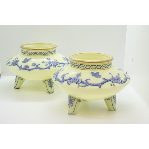 1261 - A PAIR CELADON GLASS VASES IN JAPONAISE TASTELate 19th century, with blue and white enamel prunus an... 