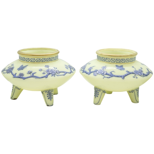 1261 - A PAIR CELADON GLASS VASES IN JAPONAISE TASTELate 19th century, with blue and white enamel prunus an... 