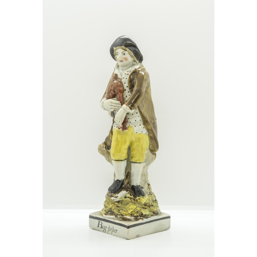 1120 - A PEARLWARE FIGURE ENTITLED 'BAG-PIPER'Cira 1820, probably Ralph Wood, 22 cms high