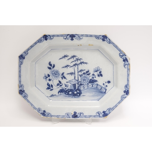 1125 - AN LARGE DELFT OCTAGONAL PLATTERMid 18th century, painted a Chinese landscape, 50cms wide