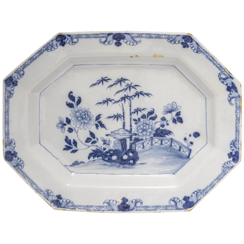 1125 - AN LARGE DELFT OCTAGONAL PLATTERMid 18th century, painted a Chinese landscape, 50cms wide