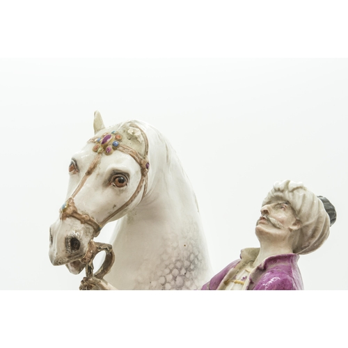 1126 - AN EQUESTRIAN FIRGURE OF A HORSE WITH TURKISH ATTENDANT19th century, probably Meissen, incised '135 ... 