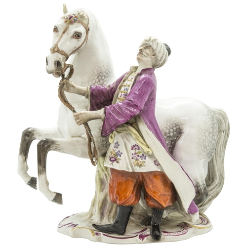 1126 - AN EQUESTRIAN FIRGURE OF A HORSE WITH TURKISH ATTENDANT19th century, probably Meissen, incised '135 ... 