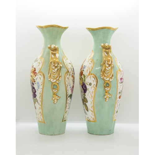 1128 - A PAIR OF STAFFORDSHIRE CELADON GROUND VASESMid 19th century, painted with floral panels and marblin... 