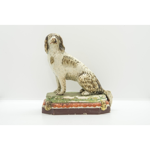 1136 - A PEARLWARE MODEL OF A HOUNDCirca 1830, 18cms high