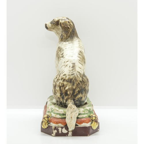 1136 - A PEARLWARE MODEL OF A HOUNDCirca 1830, 18cms high