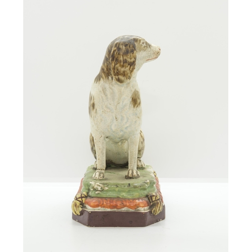 1136 - A PEARLWARE MODEL OF A HOUNDCirca 1830, 18cms high