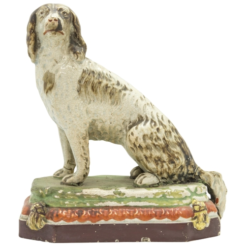 1136 - A PEARLWARE MODEL OF A HOUNDCirca 1830, 18cms high