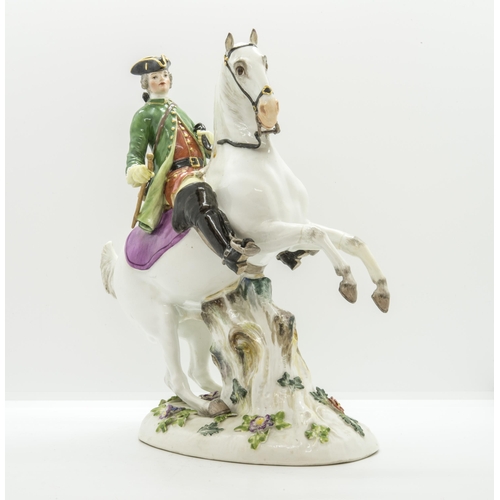 1141 - A MEISSEN EQUSTRIAN FIGURE19th century, a huntsman on a rearing horse, 26cms