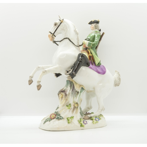 1141 - A MEISSEN EQUSTRIAN FIGURE19th century, a huntsman on a rearing horse, 26cms