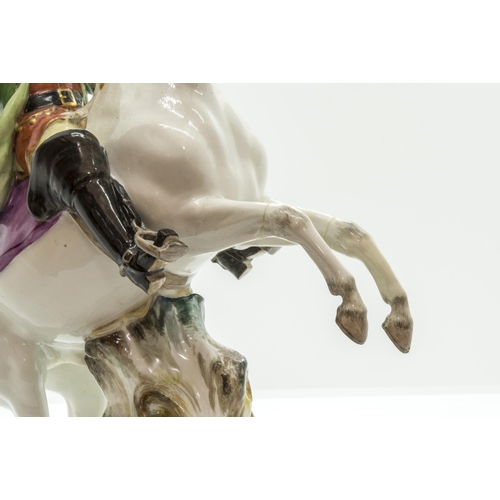 1141 - A MEISSEN EQUSTRIAN FIGURE19th century, a huntsman on a rearing horse, 26cms