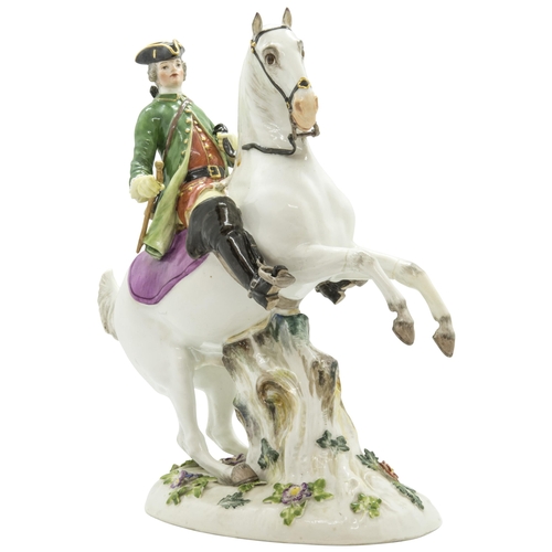 1141 - A MEISSEN EQUSTRIAN FIGURE19th century, a huntsman on a rearing horse, 26cms