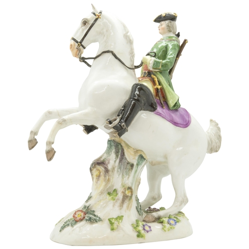 1141 - A MEISSEN EQUSTRIAN FIGURE19th century, a huntsman on a rearing horse, 26cms