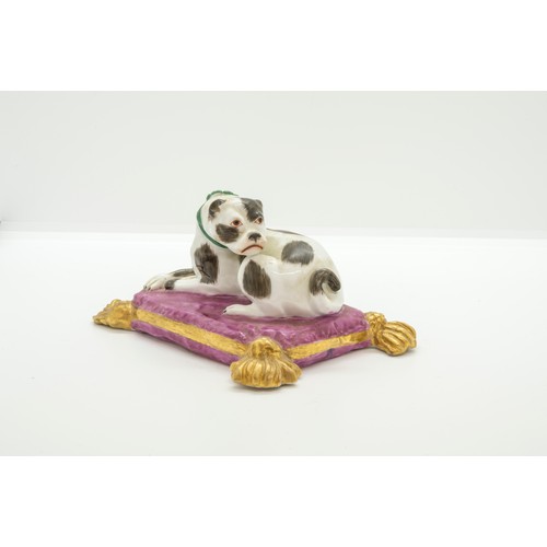 1156 - A MODEL OF A RECUMBANT HOUND ON A CUSHION19th century, 14cms