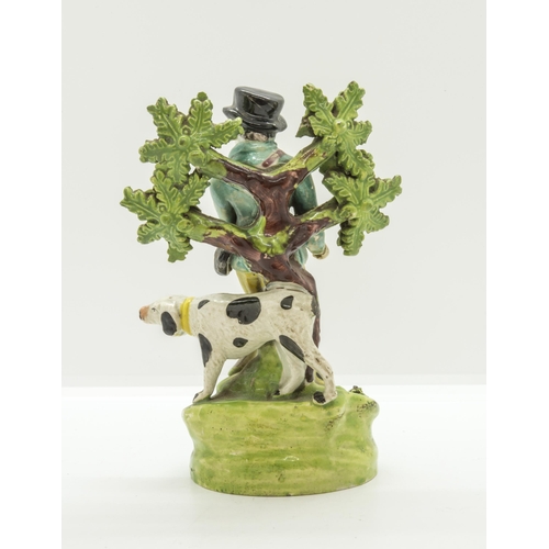 1174 - A BOVAGE GROUP OF A SPORTSMAN AND HIS DOGCirca 1830, 8cms high