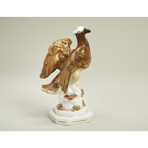 1187 - A PEARLWARE FIGURE OF AN EAGLE ON ROCKY BASECirca 1840, 19cms high