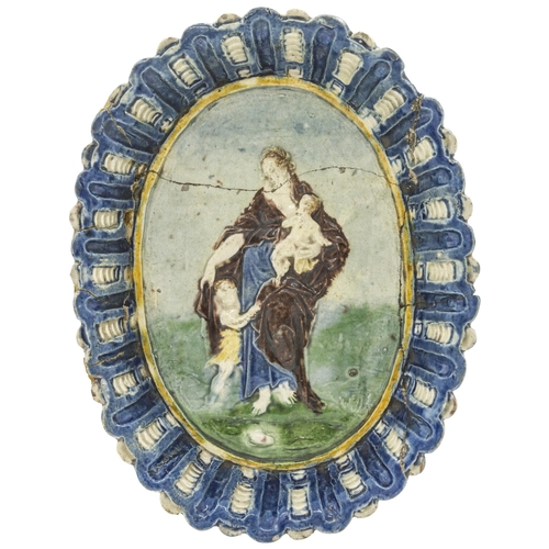 1195 - MANNER OF BERNARD PALISSY17th century or later an oval footed dish depicting Charity, 21.5cms