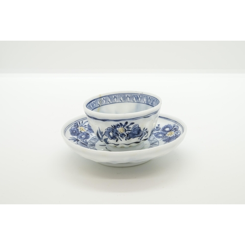 1271 - A EUROPEAN MILK GLASS TEA BOWL AND SAUCER18th century, decorated in imitation of Chinese export blue... 