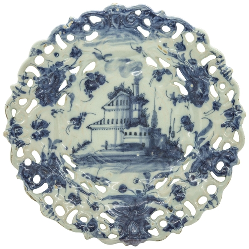 1196 - A SAVONA PIERCED FOOTED DISH17th 18th century, painted with a landscape, 29cms wide