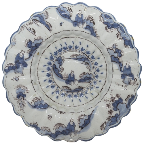 1197 - A TIN GLAZED LOBED DISH, PROBBABLY FRANKFURT18th century, decorated in underglaze blue and manganese... 