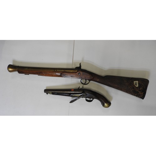 596 - A 19TH CENTURY BRASS BARRELLED BLUNDERBUSS,  converted and in poor condition and a Tower flintlock b... 