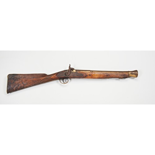 596 - A 19TH CENTURY BRASS BARRELLED BLUNDERBUSS,  converted and in poor condition and a Tower flintlock b... 