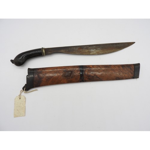 610 - AN INDONESIAN KRIS, the blade of plain form with an exotic wood wrangka. 43 cms total length