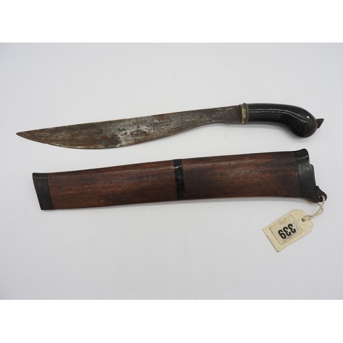 610 - AN INDONESIAN KRIS, the blade of plain form with an exotic wood wrangka. 43 cms total length