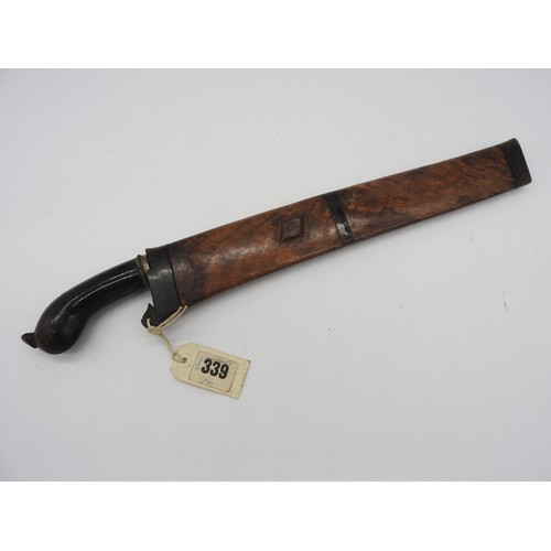 610 - AN INDONESIAN KRIS, the blade of plain form with an exotic wood wrangka. 43 cms total length