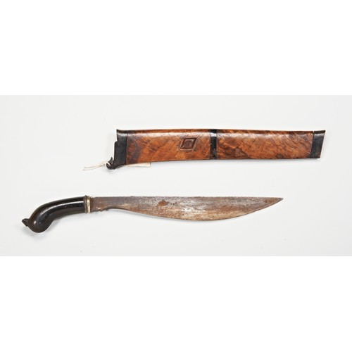 610 - AN INDONESIAN KRIS, the blade of plain form with an exotic wood wrangka. 43 cms total length