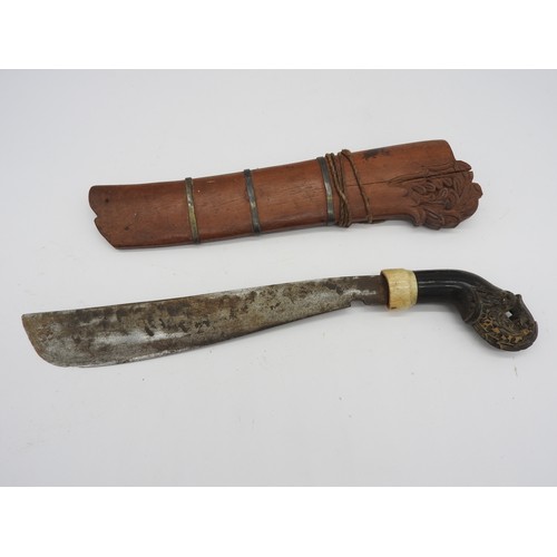 611 - AN INDONESIAN KRIS, the blade of plain form, possibly matched to it’s carved warangka and with a car... 