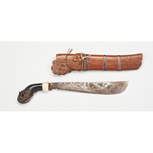 611 - AN INDONESIAN KRIS, the blade of plain form, possibly matched to it’s carved warangka and with a car... 