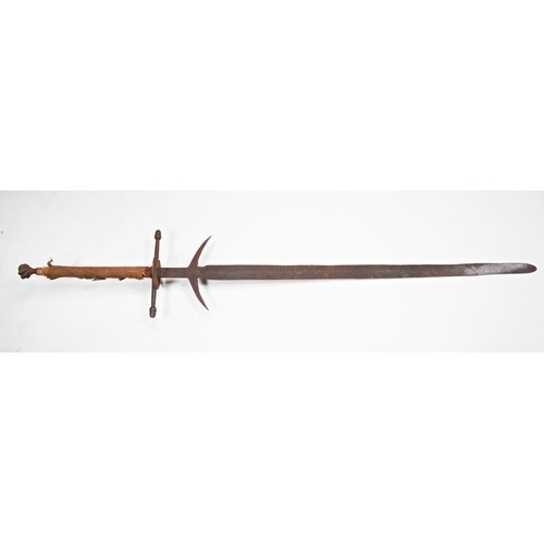 615 - A MEDIEVAL STYLE TWO HANDED GREAT SWORD with spiral pommel, large quillons, side rings and parrying ... 