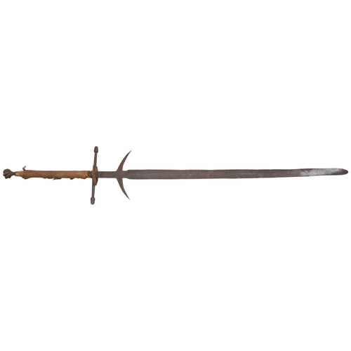 615 - A MEDIEVAL STYLE TWO HANDED GREAT SWORD with spiral pommel, large quillons, side rings and parrying ... 