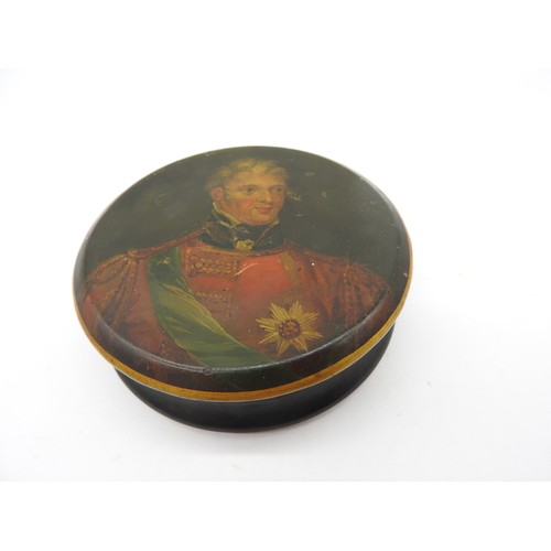 630 - A VICTORIAN CIRCULAR PAPIER MACHE BOX  the lid decorated with a portrait of the Duke of Wellington. ... 