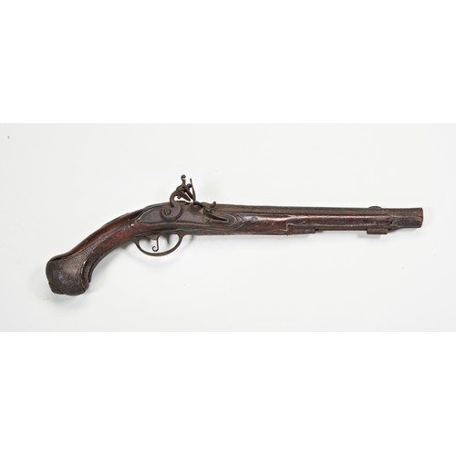 632 - AN 18TH CENTURY FLINTLOCK PISTOL the walnut stock with steel fittngs, heavily degraded, the lock app... 