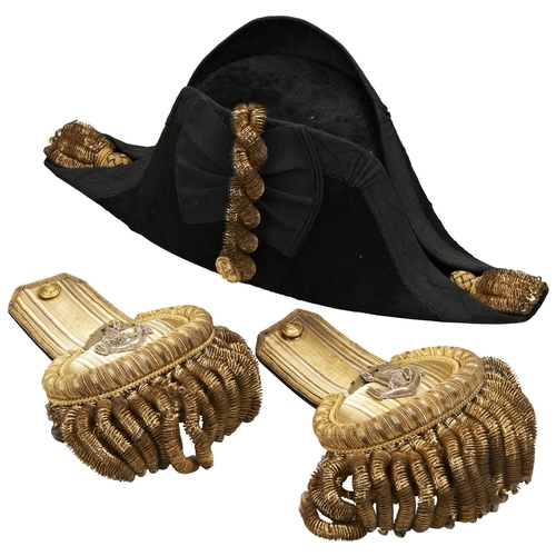 661 - A GIEVES LTD ROYAL NAVY BI-CORN HAT AND MATCHING EPAULETTES.